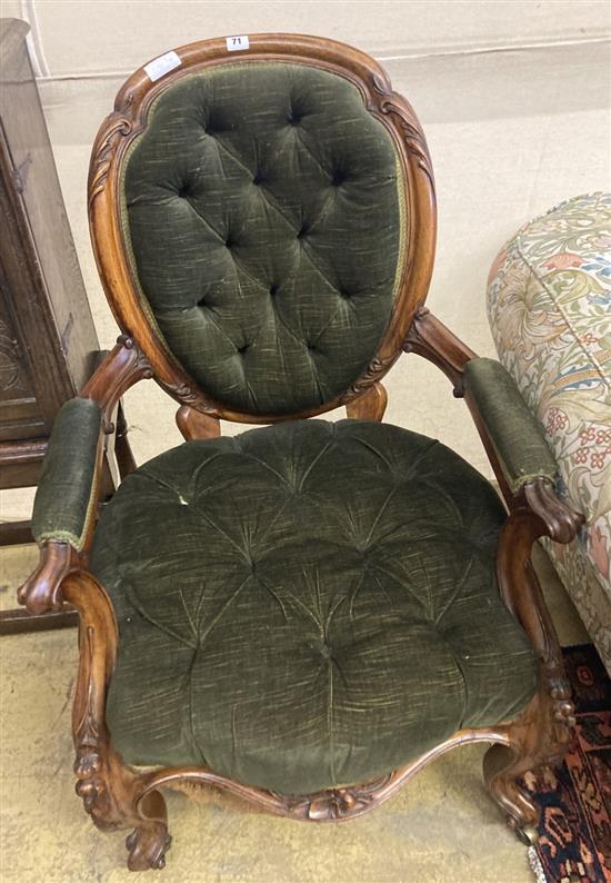 A Victorian carved walnut spoonback armchair, width 62cm, height 94cm